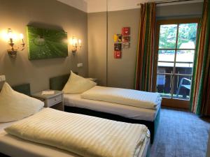 Uma cama ou camas num quarto em Hotel Edelweiss Kitzbühel