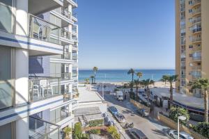 a view of the beach from a building at Apartamentos Hipocampos Calpe Rent Apart in Calpe