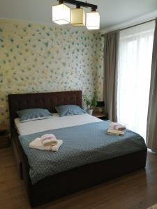 Tempat tidur dalam kamar di Vila Sidef Mamaia Nord se închiriază integral