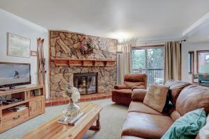 a living room with a couch and a fireplace at Park Place 104B in Breckenridge