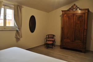 En eller flere senge i et værelse på appartamento Le Mongolfiere