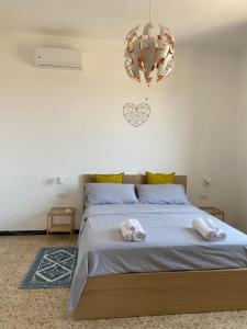 Posteľ alebo postele v izbe v ubytovaní KB House