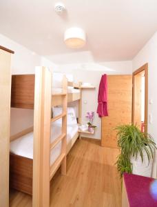 Ένα ή περισσότερα κρεβάτια σε δωμάτιο στο Appartements Kolb