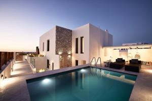 an image of a house with a swimming pool at Costa Mare Milos - Delmar Collection in Pollonia
