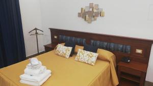 Łóżko lub łóżka w pokoju w obiekcie Hotel Tonic