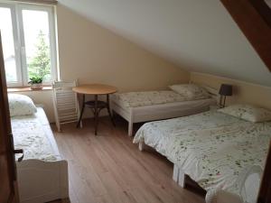 Llit o llits en una habitació de Lawendowe Siedlisko