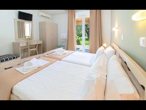 Postel nebo postele na pokoji v ubytování Villa Rania