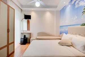 Postel nebo postele na pokoji v ubytování Hotel Sympathy