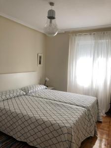 A bed or beds in a room at Casa en la playa