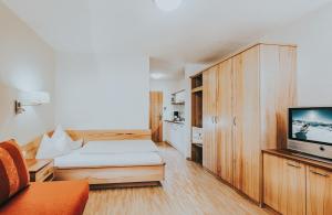Ein Bett oder Betten in einem Zimmer der Unterkunft Hotel Schneider Dependance