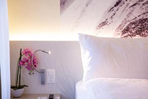 Letto o letti in una camera di Cascada Boutique Hotel