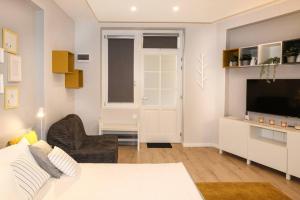 Televízia a/alebo spoločenská miestnosť v ubytovaní RP2 Apartment