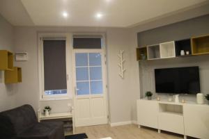 Televízia a/alebo spoločenská miestnosť v ubytovaní RP2 Apartment