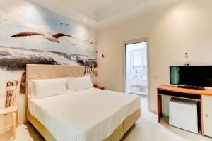 Giường trong phòng chung tại Hotel Sympathy