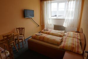 Postel nebo postele na pokoji v ubytování Penzion Hamr