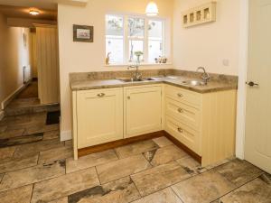 a kitchen with a sink and a counter at Stewart House in Whitby +46 photos