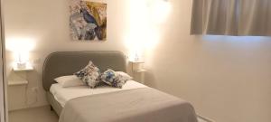 a bedroom with a bed with two pillows on it at Villa Peter in Ostuni