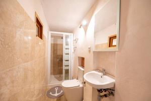 a white bathroom with a sink and a toilet at C,AN ARTUR in Binissalem +16 photos