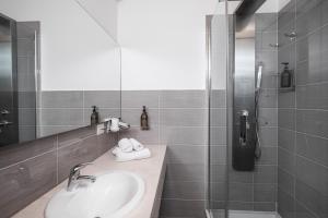 a bathroom with a sink and a shower at Hotel San Teodoro in San Teodoro