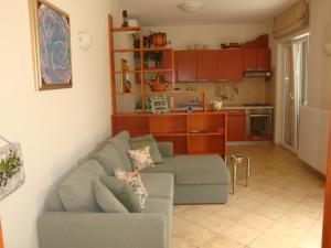 a living room with a couch and a kitchen at Apartments Mogorović in Mošćenička Draga +51 photos