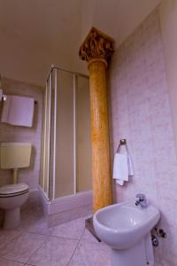 a bathroom with a shower and a toilet and a sink at Hotel La Vela-Castello Il Rifugio in Santa Margherita Ligure