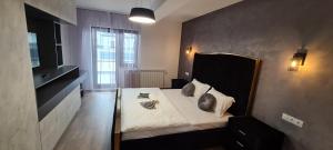 Кровать или кровати в номере Penthouse de Lux André