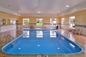 a pool room with two swimming pools at Red Roof Inn Clyde in Clyde