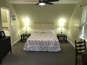 A bed or beds in a room at In Wolfville Accommodations