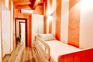 Postel nebo postele na pokoji v ubytování Casa Laura, Fosdinovo - Stile e Relax a 5 stelle