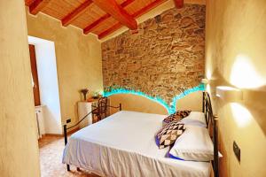 Postel nebo postele na pokoji v ubytování Casa Laura, Fosdinovo - Stile e Relax a 5 stelle