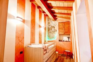 Postel nebo postele na pokoji v ubytování Casa Laura, Fosdinovo - Stile e Relax a 5 stelle