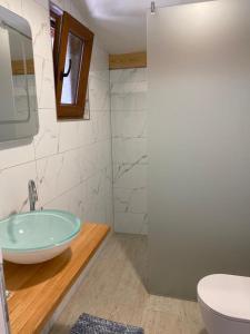 a bathroom with a sink and a toilet at PLITVICE FAIRYTALE in Plitvička Jezera +34 photos