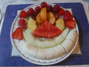 a plate with a fruit salad on a table at Morawel in Fishguard