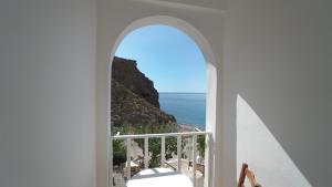 a window view of the ocean from a house at Ilingas Hotel in Hora Sfakion