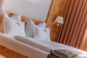 Postel nebo postele na pokoji v ubytování Hotel Chalet Dlaces