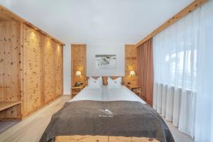 Postel nebo postele na pokoji v ubytování Hotel Chalet Dlaces