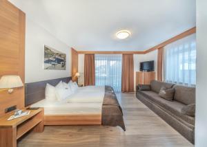 Postel nebo postele na pokoji v ubytování Hotel Chalet Dlaces