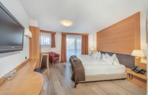 TV a/nebo společenská místnost v ubytování Hotel Chalet Dlaces