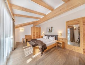 Postel nebo postele na pokoji v ubytování Hotel Chalet Dlaces
