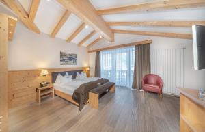 Postel nebo postele na pokoji v ubytování Hotel Chalet Dlaces