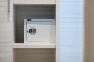 a white box in a drawer in a closet at Hotel La Nuova Rotaia in Gallarate