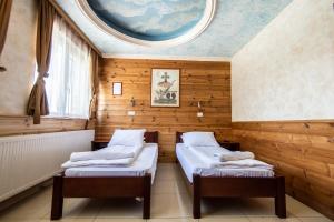 Uma cama ou camas num quarto em Hotel Enigma
