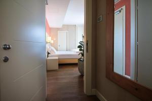 A bed or beds in a room at H2O ROOMS