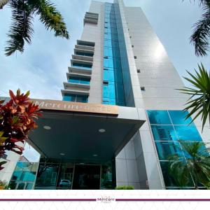 a building with a sign on the side of it at Mercure Manaus in Manaus