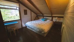 Postel nebo postele na pokoji v ubytování Hostal Climb House