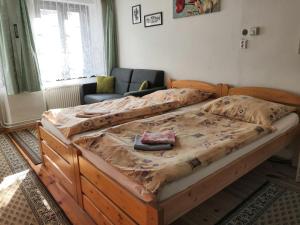 Posteľ alebo postele v izbe v ubytovaní Apartmány v centru u Moravců