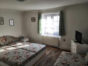 Posteľ alebo postele v izbe v ubytovaní Apartmány v centru u Moravců