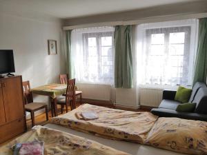 Posteľ alebo postele v izbe v ubytovaní Apartmány v centru u Moravců