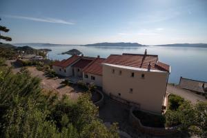 an aerial view of a house next to the water at Mima in Sveti Juraj