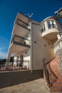 a building with two balconies and a staircase at Mima in Sveti Juraj +18 photos